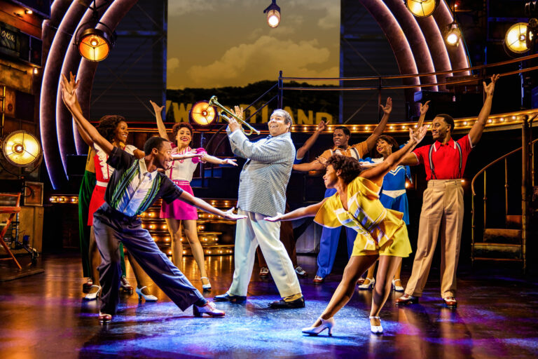 James Monroe Iglehart as Louis Armstrong at company in A Wonderful World at Broadway in Chicago